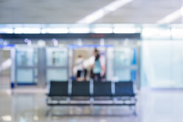 Out of focus airport Terminal with seating area.