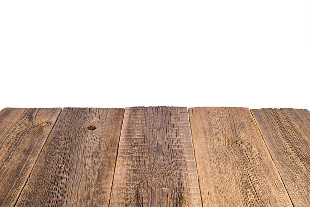istock Old vintage planked wood table in perspective on white backgroun 584467486