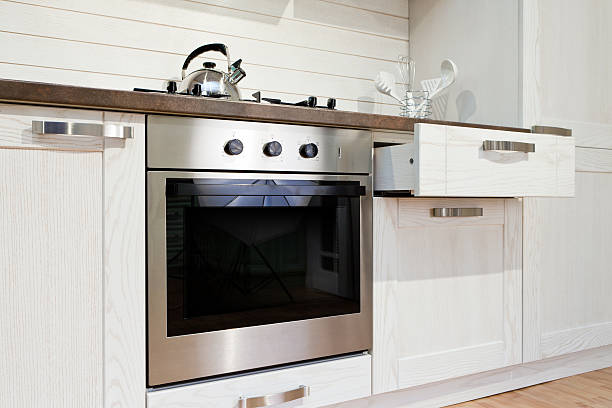 istock Luxurious new white  kitchen with modern appliances 584468818