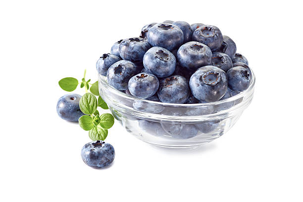 istock Blueberries in glass bowl on white. 584469480