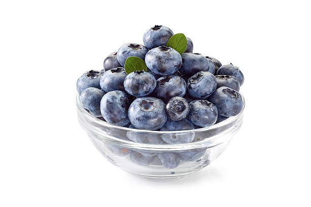 istock Blueberries in glass bowl on white. 584469588