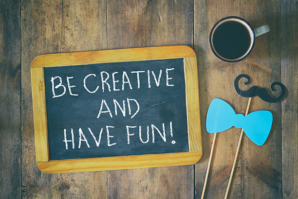 istock chalkboard with the phrase: be creative and have fun 584469678