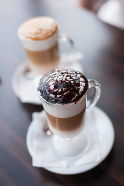 istock two glass cups of latte 584470856