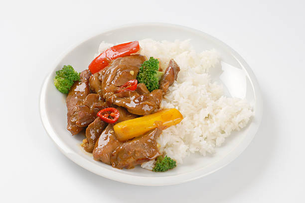 istock meat and vegetable stir fry with rice 584471050