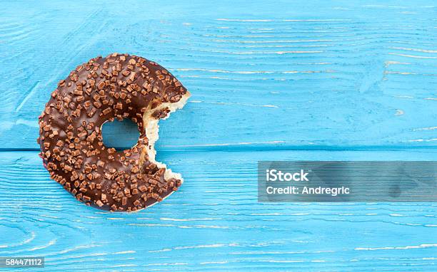 Bitten Chocolate Donut Stock Photo - Download Image Now - Biting, Baked, Baked Pastry Item