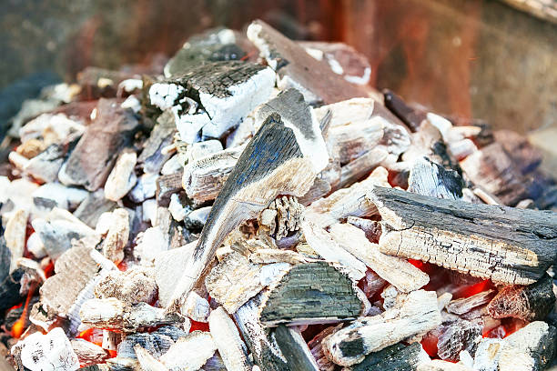 istock Burning charcoal with orange-colored flame and glow Selective Focus 584471560
