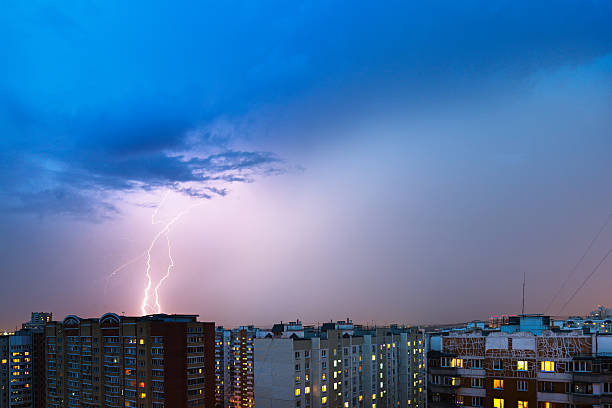 istock Storm clouds, heavy rain. Thunderstorm and lightning over the city. 584472084