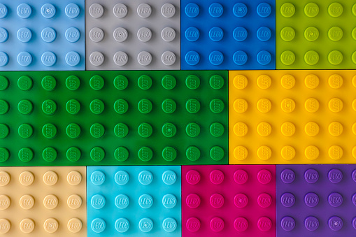 Tambov, Russian Federation - July 24, 2016 Background of some different colors Lego baseplates. Studio shot.