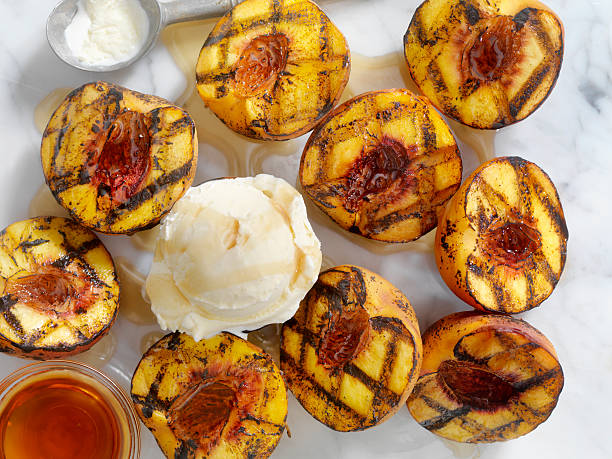 istock Grilled Peaches with Vanilla Ice Cream and Maple Syrup 584476840