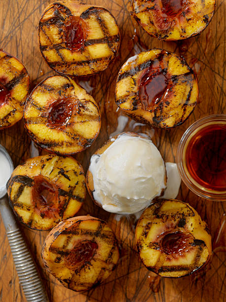 istock Grilled Peaches with Vanilla Ice Cream and Maple Syrup 584477064