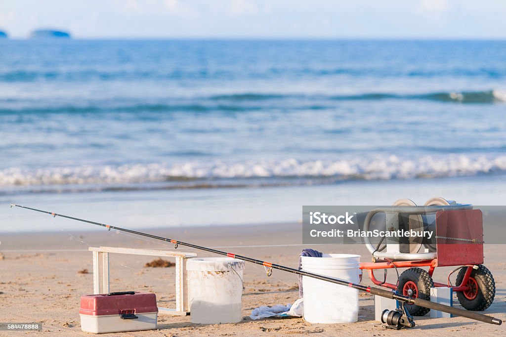 Surf Casting Fishing Rod Longline And Buckets On Beach Stock Photo