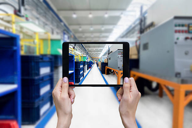istock Female hands & tablet in factory 584479144