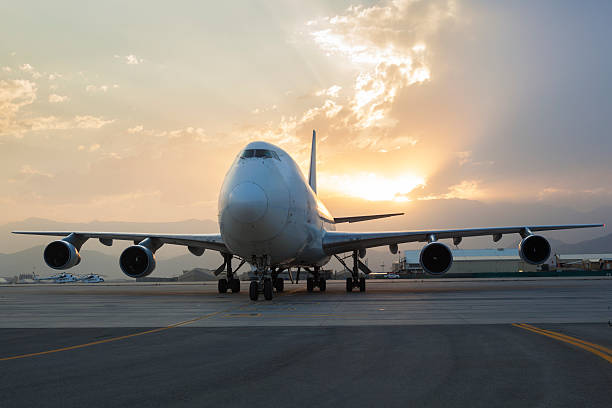 istock Airplane on taxiway at sunset 584480544