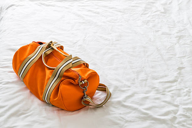 istock Orange bag on the bed 584480826
