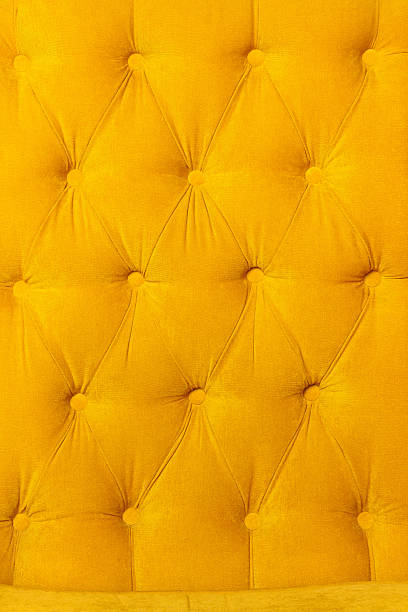 istock Background of velvet fabric modern yellow sofa 584481356