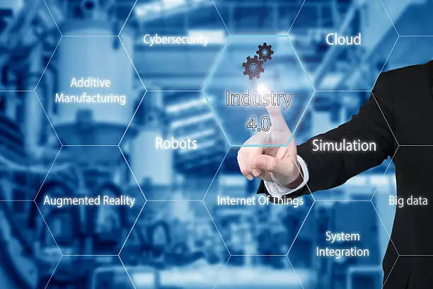 Business man touching industry 4.0 icon in virtual interface screen showing data of smart factory. Business industry 4.0 concept.