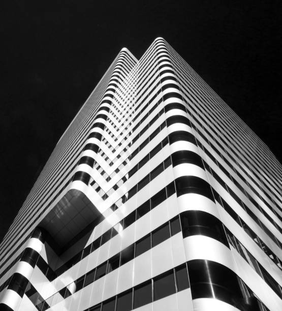 istock Highrise Skyscraper, Modern Futuristic Facaid, Black/White Portrait Format, Dutch Angle 584487154