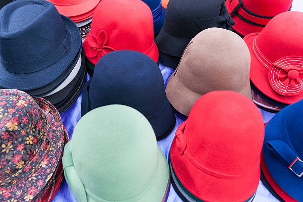 istock Flat design selection of colored hats stacked in display. 584488226