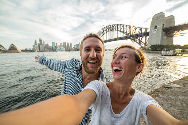 istock Two young adults take selfie at Sydney harbour 584489752