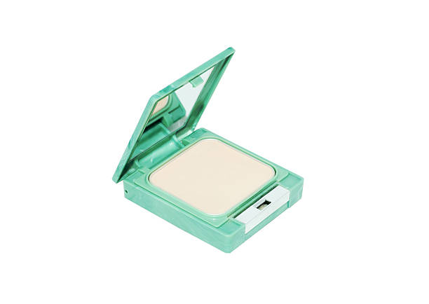 istock Compact pressed powder in green box isolated on white background. 584490346