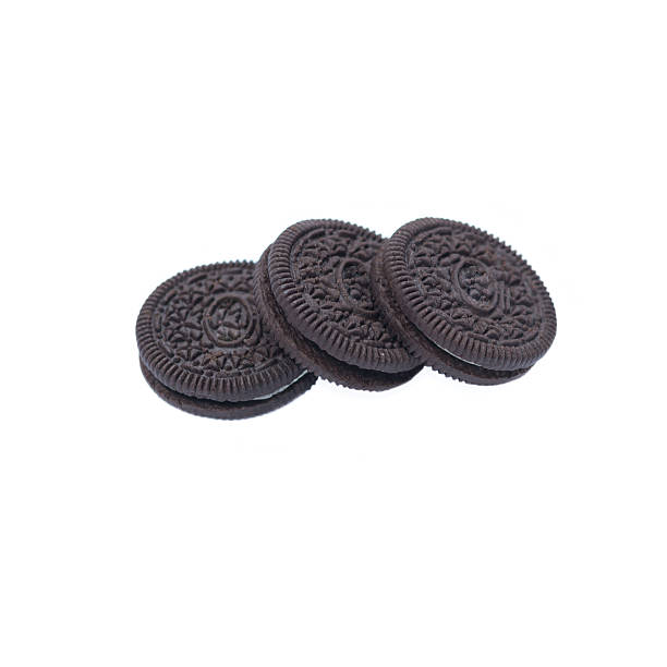 istock Chocolate cookies with creme filing isolated on white 584492868