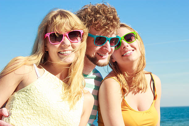 istock Group friends boy two girls having fun outdoor 584492880