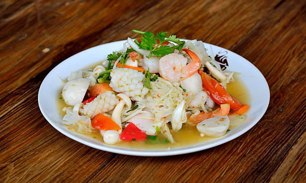 istock seafood salad on the wooden background 584493914