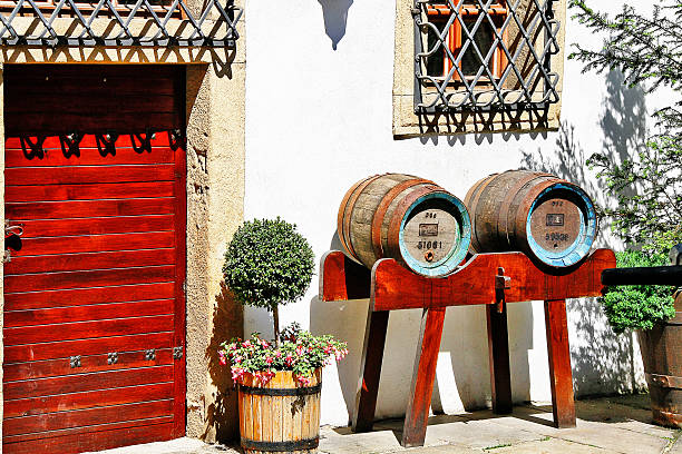 Plzen, Czech Republic - May 22, 2011 - Wooden beer barrel Plzen, Czech Republic - May 22, 2011 - Old wooden beer barrel decorate in front of house. pilsen stock pictures, royalty-free photos & images