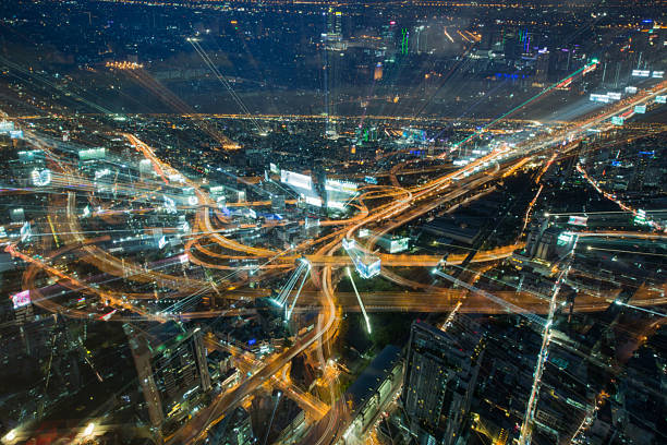 istock Abstract blurred Tolls way, expressway night time and building b 584497360