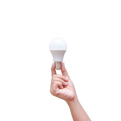 Woman hand holding LED bulb isolated on white background