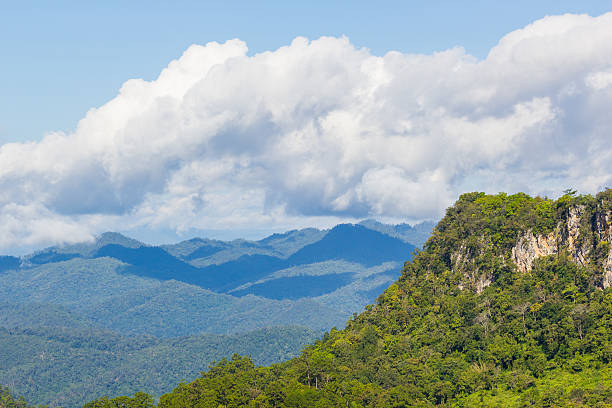 istock rock mountain cliff and blue sky 584498626