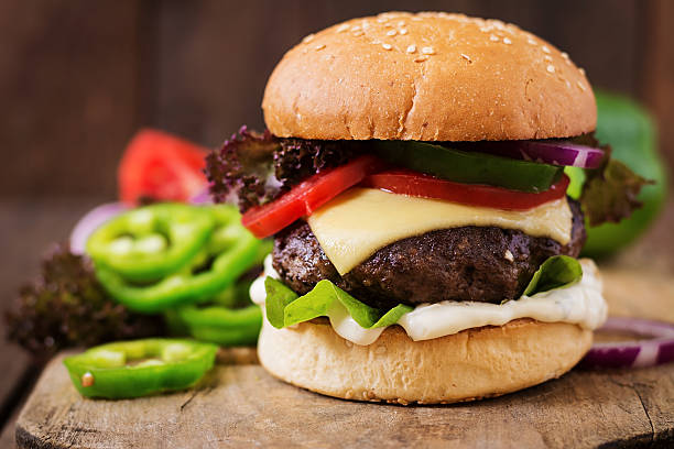 istock Big sandwich - hamburger burger with beef, cheese, tomato 584498946