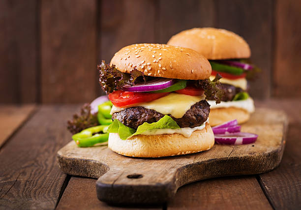 istock Big sandwich - hamburger burger with beef, cheese, tomato 584499140
