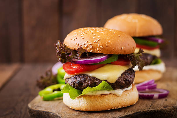 istock Big sandwich - hamburger burger with beef, cheese, tomato 584499182