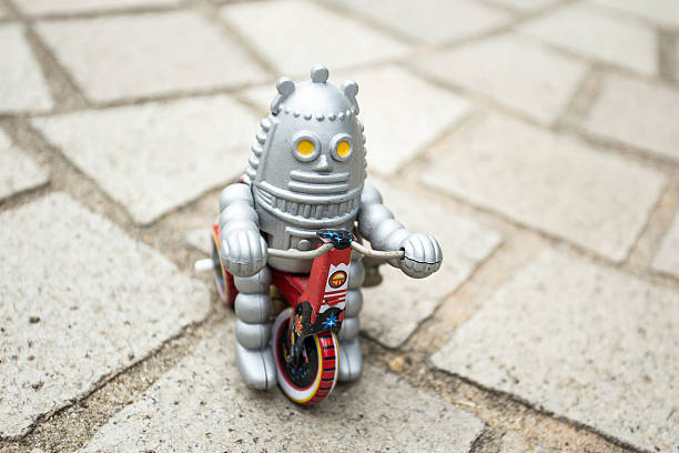istock Old classic robot toys driving. 584500682
