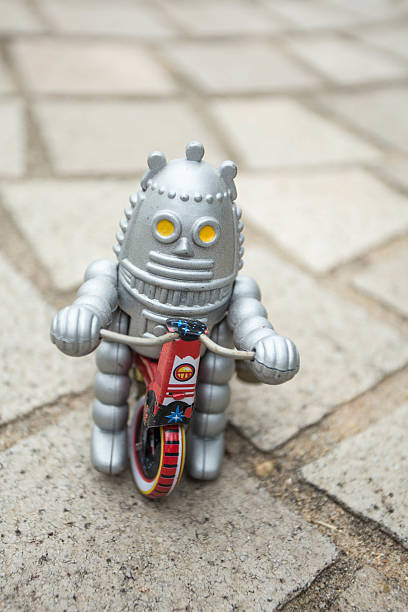 istock Old classic robot toys driving. 584500696