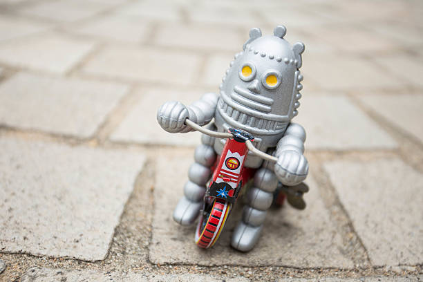 istock Old classic robot toys driving. 584500710