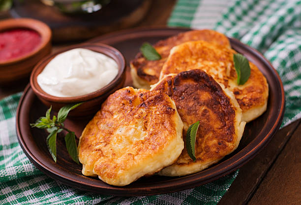 istock Cheesecakes with mint and sour cream. Breakfast. 584500856
