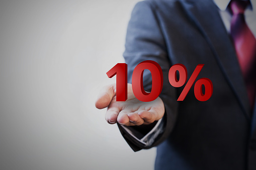 Businessman presenting ten percent graphic .