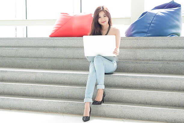 istock Happy Young Woman Using Laptop 584503890
