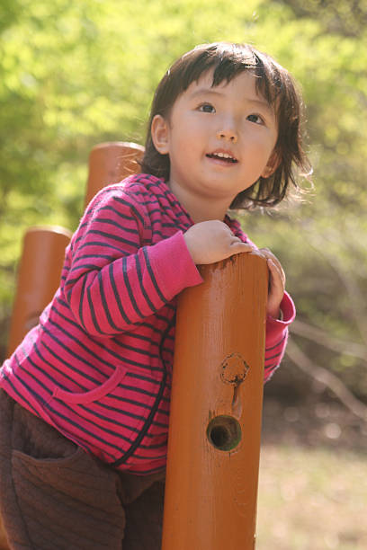 istock Toddler playing in the playground. 584503922