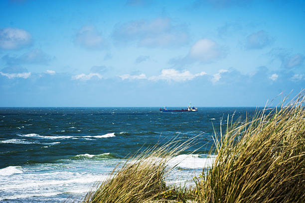 istock Ship passing at Wenningstedt Beach/ Sylt 584505520