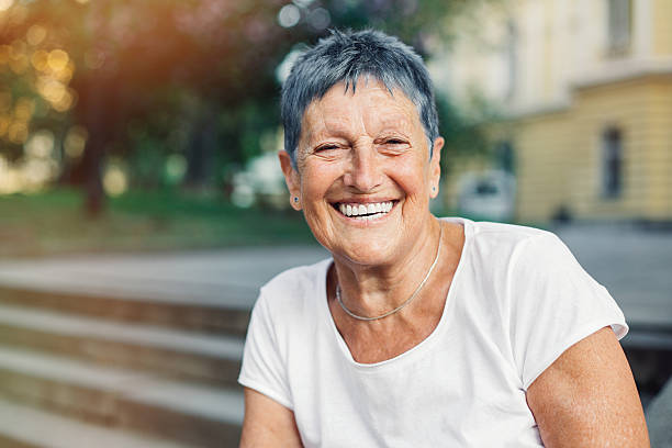 istock Happy senior woman in summer 584506462