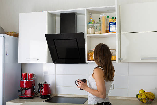 istock Woman at her kitchen in the morning 584508196
