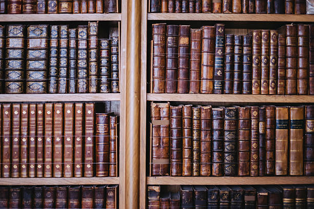 istock Collection of old books;  carefully arranged bookcase 584508634