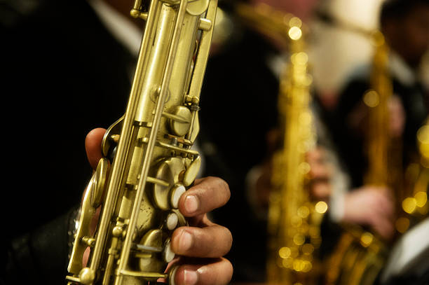 istock Saxophones with fingers on keys 584509704