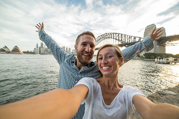 istock Young couple in Sydney harbour take a selfie portrait 584510020