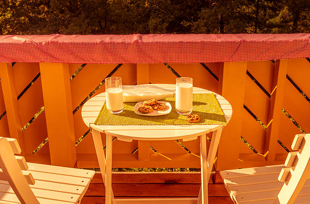 istock Cookies with milk on round table 584512088