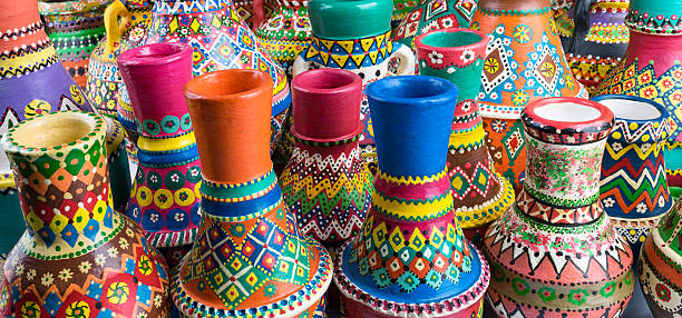 istock Composition of artistic painted handcrafted pottery vases 584512118