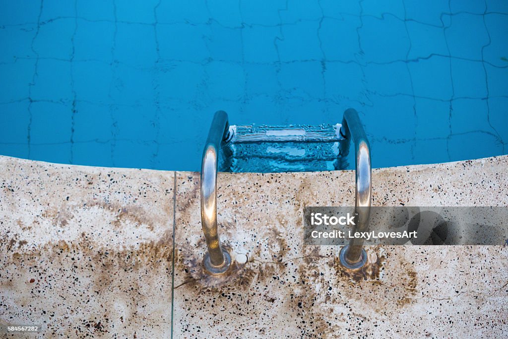 steps swimming pool Top view of the stairs leaving in a blue water pool Activity Stock Photo